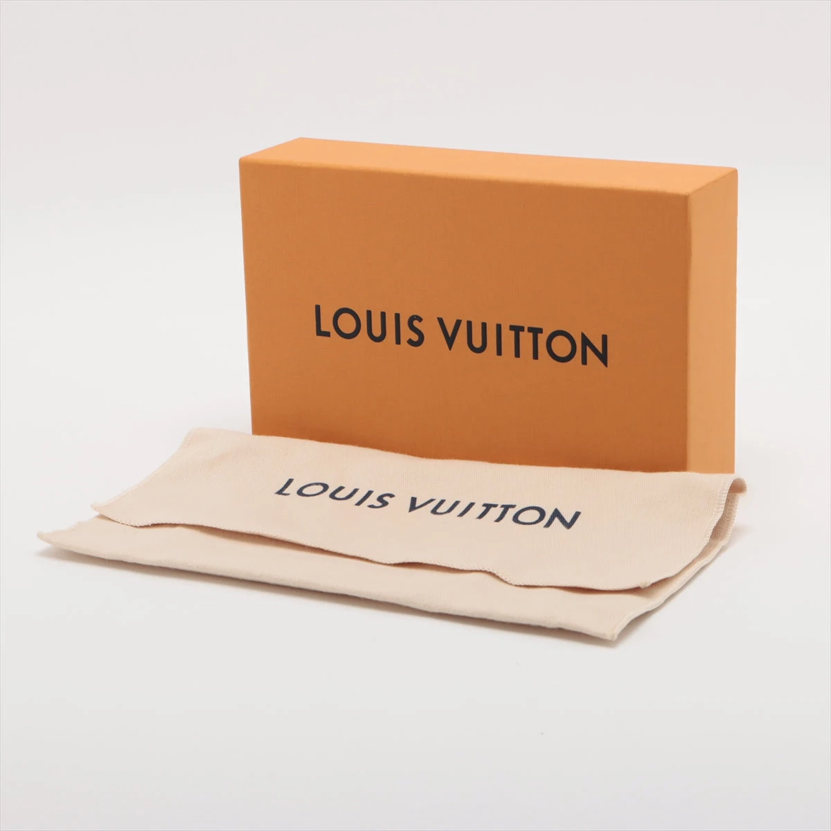ヴィトン トリヨン LV ヴェルティカル ウォレット カプシーヌ