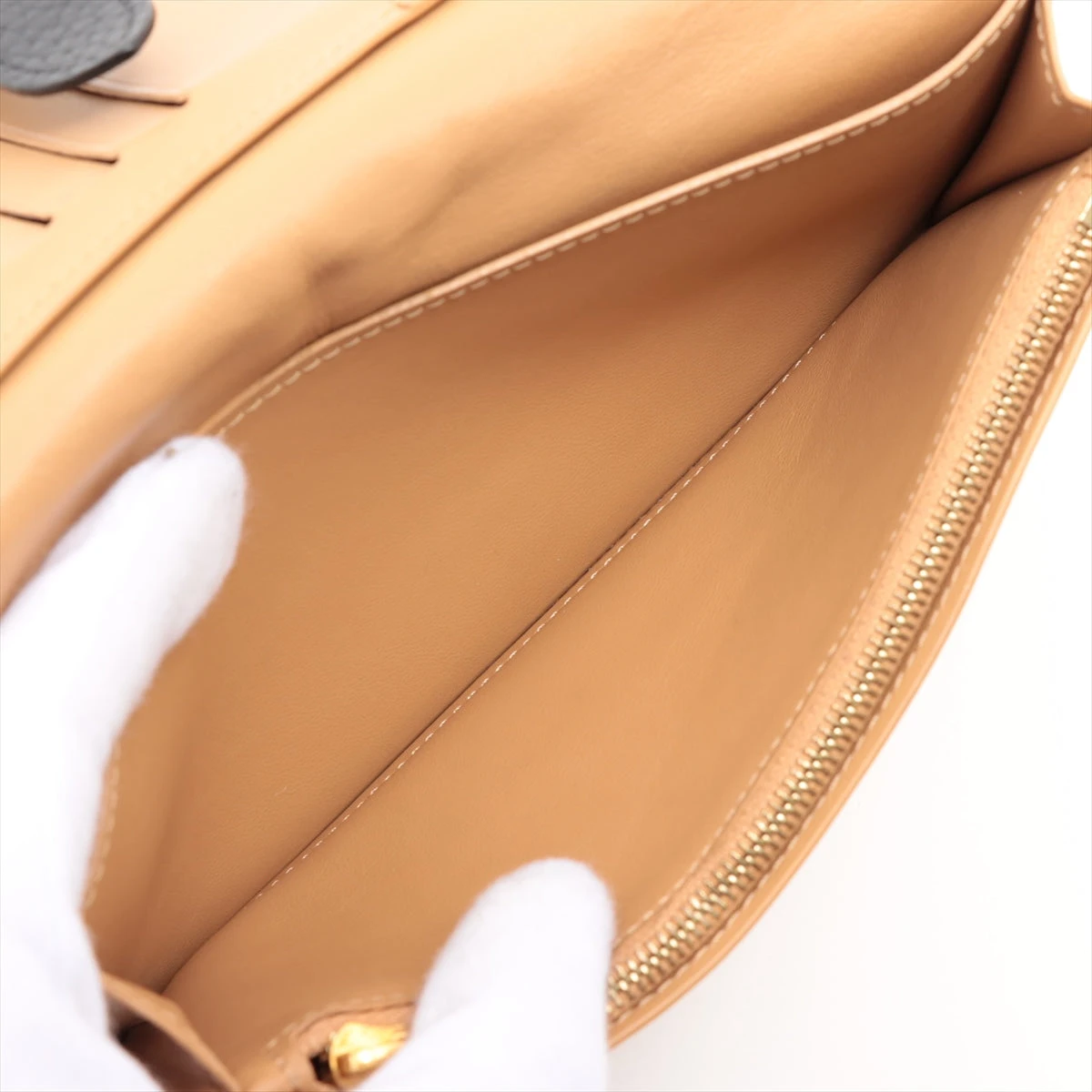 ヴィトン トリヨン LV ヴェルティカル ウォレット カプシーヌ
